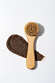 Coffee scrub and wooden brush for natural skincare