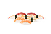 Assorted nigiri set on a plain white background