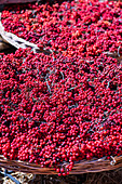 Freshly harvested red berries in wicker baskets