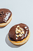 Chocolate-Covered Donuts with Peanut and Chocolate Sprinkle Toppings