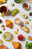 Colourful breakfast buffet with drinks and pastries