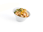 Shrimp and rice dish in a white bowl on a white background