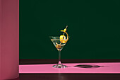 Elegant dry martini with olive and lemon zest
