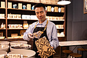 Chocolate seller presents handmade chocolate