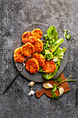 Carrot and oat patties with salad