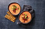 Tomato and buttermilk cold bowl with oat flakes