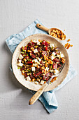 Oat and beluga lentil salad with beetroot and feta cheese
