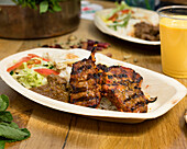 Grilled lamb chops with rice and side salad
