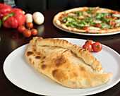 Italian calzone with cherry tomatoes