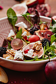 Autumn salad with figs, blackberries, goat's cheese and walnuts