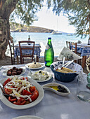 Greek lunch with tomato salad and various appetisers