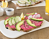 Rye bread with beetroot hummus and avocado