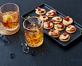 Fat Washed Old Fashioned, white bean crackers with bacon