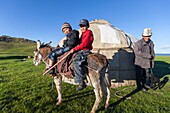 Kyrgyzstan, Naryn province, Son-Kol lake, altitude 3000m, nomadic man and children in front of a yurt