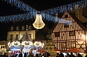 France, Cote d'Or, Dijon, area listed as World Heritage by UNESCO, Christmas lights, carousel on Place Francois Rude