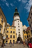 Slovakia, Bratislava, Michalska Street and the Michel Gate (Michalska Brana), a 14th century tower with the octagonal 16th century and the Baroque roof of the 18th century