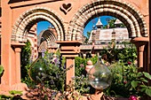 France, Haute Savoie, Rumilly, Vaulx, secret gardens, remarkable garden label, spa, vault mounted in medium technique based on lime mortar elements, glass bottles and roof of the joyful island