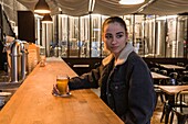 France, Indre et Loire, art is an ale brewing Amboise, a brewery installed in the former Amboise cinema, young girl at the bar