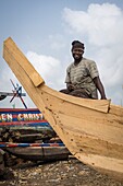 Ivory Coast, Grand Lahou district, Grand Lahou, builder of fisherman boat