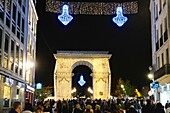 France, Cote d'Or, Dijon, area listed as World Heritage by UNESCO, Christmas lights, triumphal arch on Place Darcy