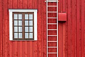 Norway, Nordland County, Lofoten Islands, Henningsvaer, red house