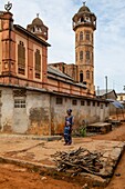 Benin, Ouidah, woman in front of the mosque