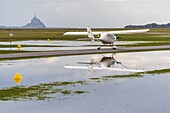 France, Manche, Avranches, Mont Saint Michel Bay listed as World Heritage by UNESCO, Abbey of Mont Saint Michel, aerodrome d'Avranches Val-Saint-Pere, small aircraft