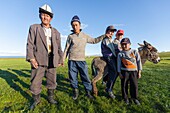 Kyrgyzstan, Naryn province, Son-Kol lake, altitude 3000m, nomadic man and children in front of a yurt camp