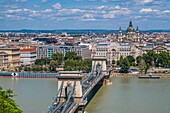 Hungary, Budapest, the Chain Bridge (Széchenyi lánchíd), crosses the Danube and connects Buda and Pest. It was built between 1839 and 1849 by the Scottish Adam Clark, according to the project of Count István Széchenyi with in the background the district of Pest