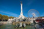 France, Gironde, Bordeaux, the Girondins monument in Place des Quinconces by Dumilatre et Rich, the 43 meter column is surmounted by a bronze statue of freedom breaking its chains which culminates at 54 m and the Ferris wheel