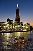 United Kingdom, London, Southwark district, London bridge quarter, boat on the river Thames in front of the More London Development and the Shard London Bridge Tower by architect Renzo Piano, the tallest tower in London