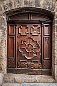 France, Alpes-de-Haute-Provence, Sisteron, street Deleuze, wooden door of the seventeenth century decorated with geometric designs Louis XIII style