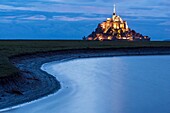 France, Manche, Mont Saint Michel Bay listed as World Heritage by UNESCO, Abbey of Mont Saint Michel at dusk