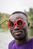 Ivory Coast, Grand Lahou district, Grand Lahou, portrait of dugoout driver in the mangrove forest