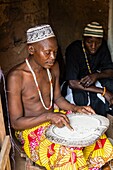 Benin, Porto-Novo, Voodoo priest reading the future with his traditional plate and cowry shells