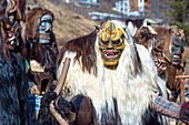 Switzerland, Valais, Lotschental valley, Wiler, Tschaggatta Carnival, costumes are made from animal skins, wooden masks and horse hair