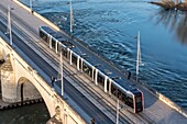 France, Indre et Loire, Loire valley listed as World Heritage by UNESCO, Tours, aerial view of the tram crossing the Loire on the Wilson bridge