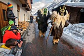 Switzerland, Valais, Lotschental valley, Wiler, Tschaggatta Carnival, costumes are made from animal skins, wooden masks and horse hair