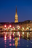 France, Gironde, Bordeaux, area listed as World Heritage by UNESCO, Saint-Pierre district, Place de la Bourse, the reflecting pool, in the background the spire of the Saint-Michel Basilica in Bordeaux