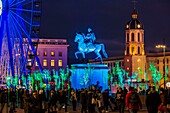 France, Rhone, Lyon, historical site listed as World Heritage by UNESCO, equestrian statue of Louis XIV on place Bellecour (Bellecour Square) during the Fete des Lumieres (Light Festival), show Prairie ephemere of TILT and Porte par le Vent