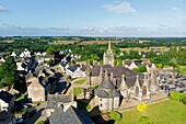 France, Finistere, Guimiliau, parish enclosure, the church, the calvary and the ossuary (aerial view)