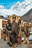 Switzerland, Valais, Lotschental valley, Wiler, Tschaggatta Carnival, costumes are made from animal skins, wooden masks and horse hair