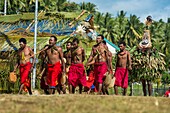 Papua New Guinea, Gazelle peninsula, New Britain island, East New Britain province, Rabaul, Kokopo, Duk duk with initiated men on a banana boat for a Kinavai ceremony for the opening ceremony of National Mask Festival of Kokopo