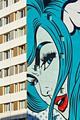 France, Paris, street art, mural called Turncoat by DFace on the facade of an apartment building in Boulevard Vincent Auriol