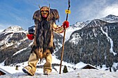 Switzerland, Valais, Lotschental valley, Wiler, Tschaggatta Carnival, costumes are made from animal skins, wooden masks and horse hair