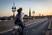 France, Gironde, Bordeaux, area listed as World Heritage by UNESCO, the Pont de Pierre over the Garonne, at the bottom the spire and the Saint-Michel Basilica in Bordeaux