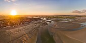 France, Somme, Baie de Somme, Le Crotoy, Sunrise over the Crotoy and the Baie de Somme at low tide (aerial view)