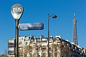 France, paris, bus stop, facade of an apartment building and Eiffel tower from Place Joffre (Joffre square)