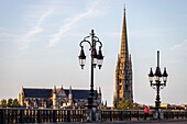 France, Gironde, Bordeaux, area listed as World Heritage by UNESCO, the Pont de Pierre over the Garonne, brick and stone vaulted bridge and in the background the church of Sainte-Marie-de- la-Bastide