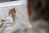 France, Indre et Loire, Loire valley listed as World Heritage by UNESCO, Tours, Offard's workshop, L'Atelier d'Offard perpetuates the know-how of planked wallpaper from the great factories of the 18th and 19th centuries, woman preparing a matrix